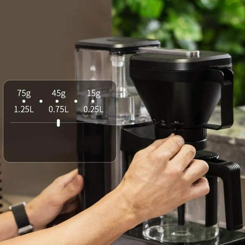 Heavy Duty Fully Automatic Espresso And Drip Coffee Maker With Digital Display adjusting settings for precise brewing.