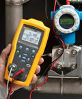 Heavy Duty Electric Pressure Calibrator With 300 PSIG Capacity And Switch Tester measuring pressure on a site instrument.
