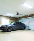 Two Foot LED Wraparound Ceiling Light Fixture That Really Pops Low Profile Flush Mount 4000K Cool White 120V 24 Inch Ultra Bright Daylight Vibe For Office Closet Garage And More installed in a garage.