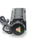 Front view of a servo motor with brake and attached drive unit; black metal housing with power cable.