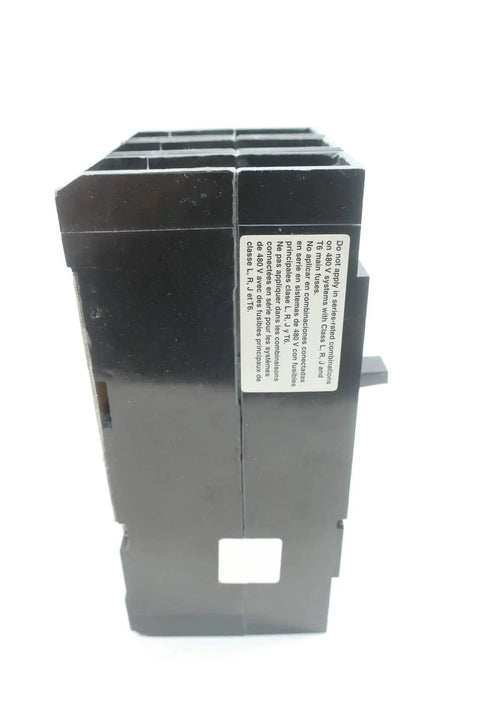 Pro Grade Heavy Duty Molded Case Circuit Breaker 3 Pole 100 Amp 600 Volt AC and 250 Volt DC close-up side view showing safety label.