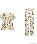 Women Western Cowboy Print Scrubs Set With Deep Multi Pocket Elastic Waist Healthcare Uniforms For Nurses And Dental Assistants, featuring V-neck top and cargo pants.