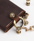 Solid Brass Bullet Rivets With Screw Posts Give Your Leather Accessories A Badass Antique Vibe Perfect For Custom Wallets And Rugged Backpack Repair Projects on a brown leather wallet with brass accents.