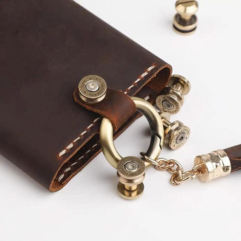 Solid Brass Bullet Rivets With Screw Posts Give Your Leather Accessories A Badass Antique Vibe Perfect For Custom Wallets And Rugged Backpack Repair Projects on a brown leather wallet with brass accents.