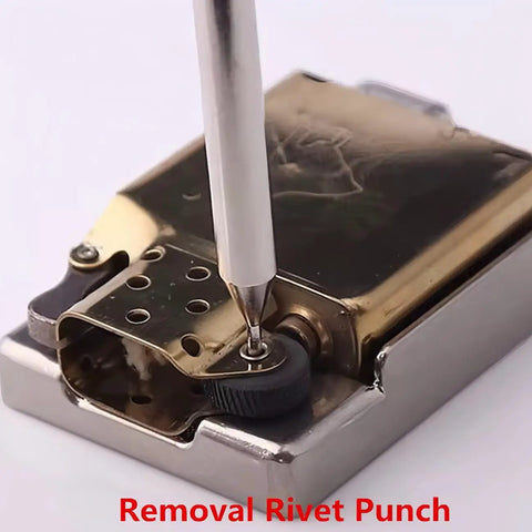 Removal rivet punch pressing against a pocket lighter, part of the Complete 5 Piece Lighter Repair Tool Kit With Heavy Duty Steel Wheel Rivet Punch Set And Secure Fix Base For Inner Liner Restoration Badass Fix Gear For Everyday Carry Crew.