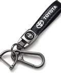 Premium Leather Car Keychain Set For Toyota Corolla RAV4 Highlander featuring a black leather strap and zinc alloy clips.