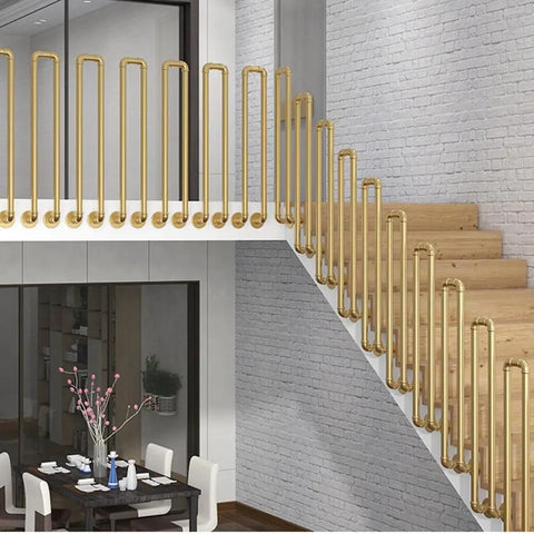 Tough As Nails Industrial Pipe Railing Featuring Slick Non Slip Iron Guardrail for indoor outdoor steps and decks with gold finish.