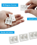 Twenty Piece Pack Of White Right Angle Brackets Heavy Duty Plastic L Shape Corner Braces For Woodworking Diy Builds Durable Corrosion Proof Hardware Fasteners Built To Rock in hand showing smooth surface.