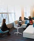 Game Changer Adjustable Lectern Podium Stand With Smooth Wheels in a modern meeting space for collaborative discussions.