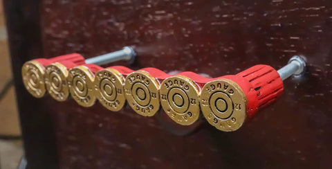 Killer Rustic Western 12 Gauge Shotgun Shell Bar Pulls For Cabinets And Drawers Hella Tough Ammo Casing Hardware Pack Of Four on dark wood