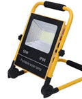 Rugged Rechargeable Led Work Flood Light With Solar Panel And IP65 Weatherproof Design 50 Watt portable solar lamp standing on support.