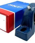 Pillow Block Mounted Ball Bearing UCP205-16 with 1 inch shaft bore, cast iron housing, shown with packaging.