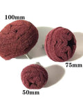 Three red non-woven abrasive mushroom buffs of various sizes from the 7 Piece Red Non Woven Abrasive Drill Buffing Attachment Set with One Quarter Inch Shank.