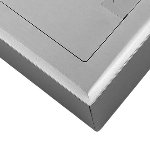 Close-up view of Heavy Duty Pop Up Floor Power Outlet Featuring Double Three Prong Sockets And Brushed Silver Stainless Steel Housing.