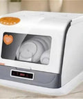 Compact Countertop Dishwasher Featuring Hot Water Sanitizing And Rapid Dry Cycle A Real Game Changer For Tight Kitchens Making Cleanup A Breeze For Busy Folks Who Want That Smooth Experience with visible dishes inside.
