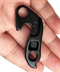 Black beefy rear derailleur hanger 11 replacement for select road and gravel bikes, CNC machined alloy, in hand view, part 9893-4291