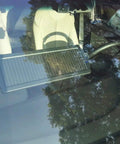 Solar Car Battery Trickle Charger And Maintainer For 12V Vehicles installed on car dashboard behind windshield