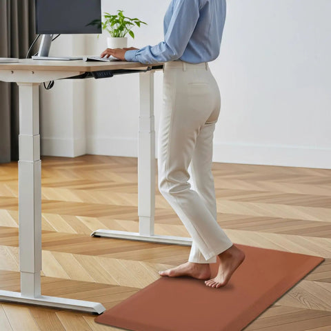 Person standing on All Day Comfort Anti Fatigue Kitchen Floor Mat With Cushy PVC Construction Waterproof Non Slip Rug For Standing Eco Friendly Non Toxic Materials Flat Puncture Resistant Design 39 By 20 Inch in home office