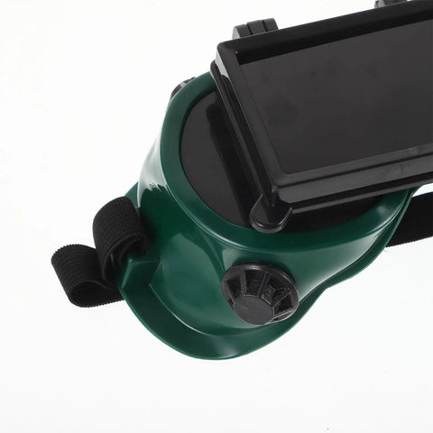 Heavy Duty Industrial Welding Safety Goggles With Dual Lens Impact Protection And Dustproof Housing Rock Solid Eye Shield For Welders showing green housing and flip lens mechanism.