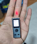Pocket Size Laser Distance Meter 164 Ft Range USB Rechargeable held in hand showing LCD screen and laser pointer