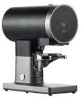 Badass Electric Espresso Tamper Serving Dead Center Pressure Tracking With A Slick Quick Swap Bracket That Slides Right Over Every Standard 58 Millimeter Portafilter, black and silver design.