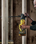 Pro Grade Brushless Cordless Drill Kit With 7/16 Inch Quick Change Chuck E Clutch Protection Compact Stud Joist Setup in use drilling into wood.