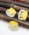 30 Pack Adjustable Button Spring Buckles Plastic Rope Locks With Toggle Fasteners Go To DIY Gear Multi Purpose Snap Joints For DIY Projects And Clothing, Fits Hoodies Sweatpants Jackets Backpacks Five Random Colors. Yellow plastic rope lock buckles shown close up