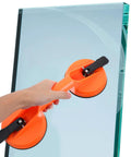 Super Tough Heavy Duty Industrial Handheld Vacuum Lifter With Dual Suction Cups being used on a glass panel.