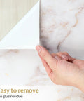 Hand peeling Marble Peel And Stick Countertop Wallpaper 35.4 By 78.7 Inches Waterproof Self Adhesive Roll showing easy removal
