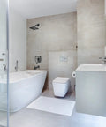 Modern bathroom with Single-Handle Tub And Shower Faucet Set with Pressure-Balancing Valve Included, matte black finish.