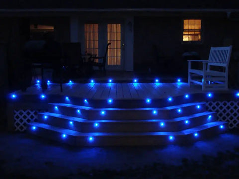 Deck illuminated by Low Voltage Blue LED Deck Lights Kit With 20 Waterproof Recessed Lamps, IP67 in-ground outdoor lighting setup.