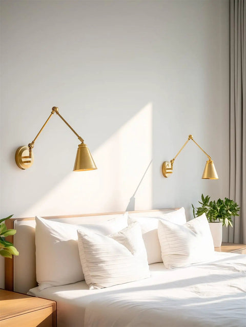 Ellis 18 Inch Two Pack Modern Gold Swing Arm Wall Sconces With Cone Shades Adjustable Heads above bed in bedroom, warm brass finish