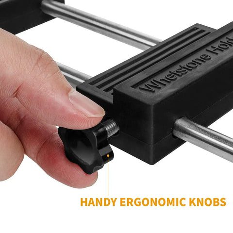Close-up of adjustable whetstone stone holder with non slip base for secure knife sharpening, featuring ergonomic knob adjustment.