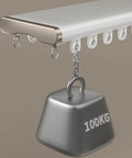 Close-up of heavy duty ceiling curtain track system with double rails and 100kg weight, white finish, mounted sample.