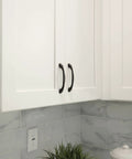 Oil Rubbed Bronze Cabinet Pull Handle Six And A Quarter Inch Length Five Inch Center To Center Traditional Classic Style on white cabinets.