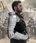 Adult man wearing Medieval Single Pauldron Spartacus Cosplay Armor Arm Sleeve for LARP Gladiator Knight Costume in silver metal