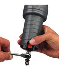 Hands using wrench on Corded Router With 4.5 Amp Motor And 31,000 RPM, Quarter Inch Laminate Trim, Spindle Lock for bit change