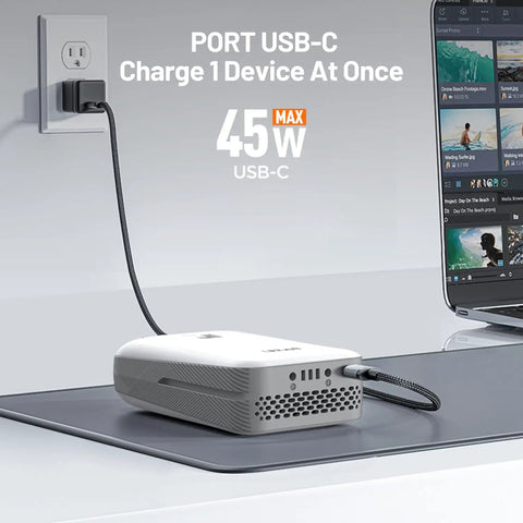 USB-C charger plugged into wall socket with cable connected to a device, displaying '45W max' power output.