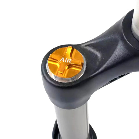 Gold Aluminum Front Fork Cap Suspension Cover for Mountain and Road Bikes installed on bike fork, lightweight alloy shield.