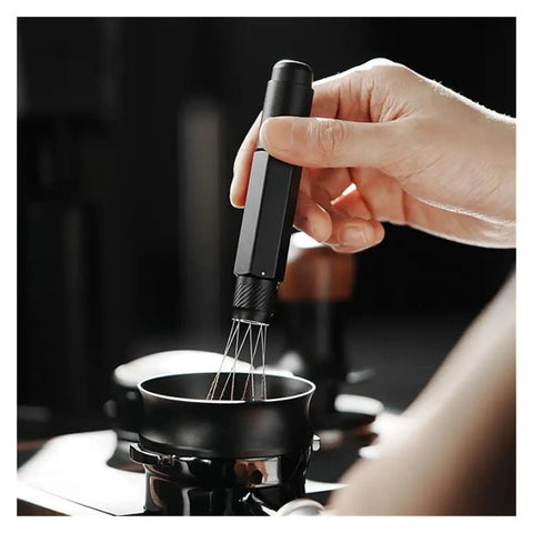 Top Shelf Telescopic WDT Tool For Espresso Distribution With 8 Bonus Stainless Steel Needles in action stirring coffee grounds.