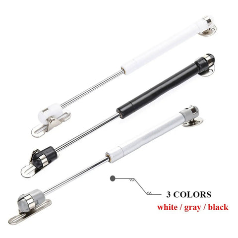 Soft Close Gas Strut Lift Support For Kitchen Cabinet Hinges And Cupboard Doors With Copper Core Hydraulic Rod Hidden Door Support For Toy Boxes And Tool Chests Heavy Duty Zinc Plated Cabinet Lift For Lids in white, gray, and black