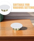 Four Piece White Ceiling Fire Sprinkler Protector Covers With Slick Decorative Trim Rings And Concealed Escutcheon Plates For Indoor Use That Provide Straight Up Protection And No Sweat Setup on wooden surface.