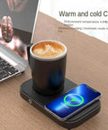 No Fuss Temperature Control Coffee Mug With 15W Wireless Charging Pad Heats To 130 Degrees Cools To 40 Degrees Black on desk with laptop.