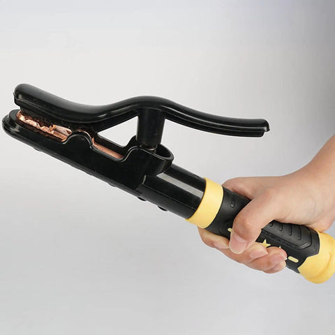 Heavy Duty Copper Welding Clamp For 800 To 1000 Amp Stick Welders High Heat Burn Shield Ground Electrode Holder Super Cool Grip Tool held in hand.