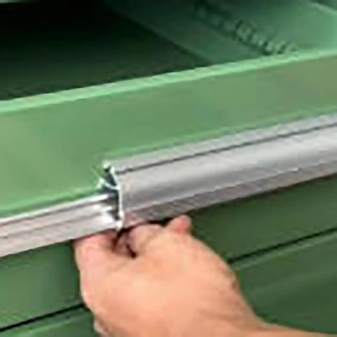 Close-up of hand operating the lock mechanism of Snag This Top Shelf Lockable Steel Tool Cabinet for secure storage.