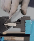 Hands using 6 Inch Vise Mount Metal Brake Bender Attachment for 4 inch or wider vises that bends 14 gauge steel detail.