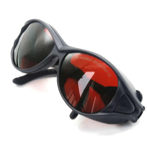 Badass OD4 Plus Laser Safety Goggles Offering Rock Solid Eye Shield From UV Through Near Infrared Bands Designed For Heavy Duty Lab Work And Precision Manufacturing Delivering Top Tier Rad Protection For Pros Who Crave Zero Compromise Performance - close-up view with red lenses and black frame