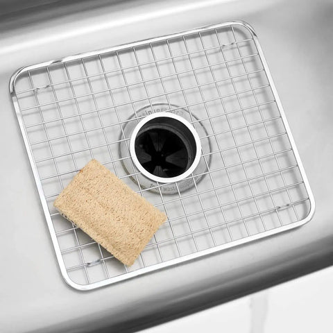 Stainless Steel Sink Grid With Center Drain Polished Finish For Kitchen Use Tough As Nails Heavy Duty Protective Rack That Prevents Scratches Doubles As A Draining Tray And Drying Rack Fits Most Standard Sinks placed in sink with sponge