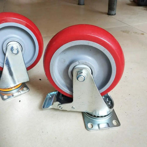 Heavy Duty Swivel Caster Wheels Four Pack Polyurethane Trolley Casters With Double Ball Bearings and Two Brake Plates, red wheels on steel brackets.