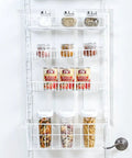 Over The Door Pantry Organizer Rack With Six Adjustable Shelves, white steel, loaded with jars and containers on white door